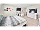 Bedroom featuring a comfortable bed, neutral colors and functional furnishings for a relaxing retreat at 13068 Oak Hill Way, Parrish, FL 34219