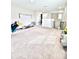 Spacious bonus room featuring neutral walls and plush carpeting, perfect for entertaining or relaxation at 13068 Oak Hill Way, Parrish, FL 34219