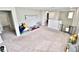 An upstairs loft area featuring comfortable carpeting with multiple rooms attached at 13068 Oak Hill Way, Parrish, FL 34219