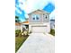 Inviting two-story home showcasing a modern design, two-car garage and well-maintained landscaping at 13068 Oak Hill Way, Parrish, FL 34219