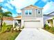 Inviting two-story home showcasing a modern design, two-car garage and well-maintained landscaping at 13068 Oak Hill Way, Parrish, FL 34219