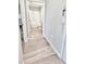 Hallway with access to a bathroom featuring a shower and tub combination at 13068 Oak Hill Way, Parrish, FL 34219