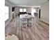 Open-concept living area with modern decor, neutral paint, hardwood floors, and ample natural light at 13068 Oak Hill Way, Parrish, FL 34219