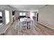 Open-concept living area with modern decor, neutral paint, hardwood floors, and ample natural light at 13068 Oak Hill Way, Parrish, FL 34219
