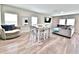 Comfortable living area with lots of natural light, modern furnishings and wood flooring at 13068 Oak Hill Way, Parrish, FL 34219