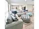 Cozy living room featuring a large sectional sofa and an open floor plan at 13068 Oak Hill Way, Parrish, FL 34219