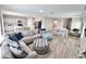 Spacious living area with open floor plan, seamlessly connecting the living room and kitchen at 13068 Oak Hill Way, Parrish, FL 34219