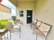 Spacious outdoor porch featuring comfortable seating for relaxing and entertaining guests at 13068 Oak Hill Way, Parrish, FL 34219