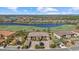 Aerial view showcases a residential complex with a pool near a lush golf course at 13711 Messina Loop # 101, Bradenton, FL 34211