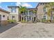 Charming two-story home boasts stone accents, lush landscaping, and a welcoming entrance at 13711 Messina Loop # 101, Bradenton, FL 34211
