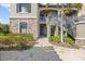 Inviting exterior of a home with a stone facade and well-maintained landscaping at 13711 Messina Loop # 101, Bradenton, FL 34211