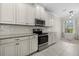 Well-equipped kitchen featuring stainless steel appliances and ample white cabinetry at 13711 Messina Loop # 101, Bradenton, FL 34211