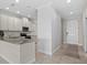 Spacious kitchen with stainless steel appliances and a granite countertop island at 13711 Messina Loop # 101, Bradenton, FL 34211
