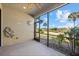 Relaxing screened patio with a view of the golf course and lush tropical landscaping at 13711 Messina Loop # 101, Bradenton, FL 34211