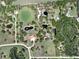 Expansive property featuring multiple ponds, lush greenery, and a beautiful home with an orange tile roof at 1450 & 12001 Bern Creek Loop, Sarasota, FL 34240