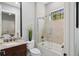 Cozy bathroom featuring tile flooring, glass enclosed shower, and a single vanity at 14817 Secret Harbor Pl, Lakewood Ranch, FL 34202