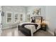 Charming bedroom with large windows, plantation shutters, and cozy window bench at 14817 Secret Harbor Pl, Lakewood Ranch, FL 34202