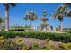 Beautiful water fountain surrounded by palm trees and colorful flowerbeds at the community at 14817 Secret Harbor Pl, Lakewood Ranch, FL 34202