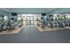 The gym features modern equipment, including treadmills and ellipticals, and expansive windows offering scenic views at 14817 Secret Harbor Pl, Lakewood Ranch, FL 34202