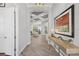 Hallway with art, console table, and view into main living area at 14817 Secret Harbor Pl, Lakewood Ranch, FL 34202