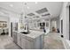 Spacious kitchen island offers seating and overlooks the inviting living room area at 14817 Secret Harbor Pl, Lakewood Ranch, FL 34202