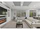 Spacious living room featuring a plush sectional and outdoor views at 14817 Secret Harbor Pl, Lakewood Ranch, FL 34202