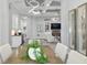 Bright living area featuring modern lighting and seamless transition from kitchen to living at 14817 Secret Harbor Pl, Lakewood Ranch, FL 34202