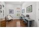 Dedicated home office space with ample natural light and hardwood flooring at 14817 Secret Harbor Pl, Lakewood Ranch, FL 34202