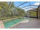 Relax and unwind by the pool and spa in this private backyard oasis at 14817 Secret Harbor Pl, Lakewood Ranch, FL 34202