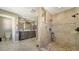 The bathroom features an elegant vanity and walk-in shower with decorative tile and dual showerheads at 1533 Oak Way, Sarasota, FL 34232