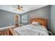 This bedroom has a ceiling fan, wood floors, and a walk in closet at 1533 Oak Way, Sarasota, FL 34232