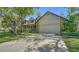 Charming two-story home featuring a brick facade, well-maintained landscaping, and a spacious driveway leading to the garage at 1533 Oak Way, Sarasota, FL 34232