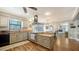 Stylish kitchen featuring stainless steel appliances, gray cabinets and a breakfast bar at 1533 Oak Way, Sarasota, FL 34232