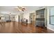 View of the open living space featuring hardwood floors, staircase, and natural light at 1533 Oak Way, Sarasota, FL 34232