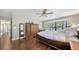 Spacious bedroom with hardwood floors, bay window, king size bed, and desk area at 1533 Oak Way, Sarasota, FL 34232