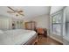 Comfortable bedroom with hardwood floors, bay window, and a desk area at 1533 Oak Way, Sarasota, FL 34232