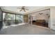 View from screened porch into the living room through large, sliding glass doors at 1533 Oak Way, Sarasota, FL 34232