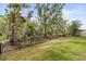 Beautiful backyard with well-maintained lawn and black metal fence at 17108 Harvest Moon Way, Bradenton, FL 34211
