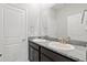 Well-lit bathroom showcasing a double vanity with granite countertops and ample storage space at 17108 Harvest Moon Way, Bradenton, FL 34211