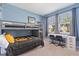Stylish bedroom with bunk beds, a sleek desk setup, and plenty of natural light at 17108 Harvest Moon Way, Bradenton, FL 34211