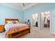Cozy bedroom featuring a charming vanity, en suite bathroom, and spacious walk-in closet at 17108 Harvest Moon Way, Bradenton, FL 34211