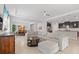 Bright and airy living room featuring an open concept floor plan, modern furnishings, and lots of natural light at 17108 Harvest Moon Way, Bradenton, FL 34211