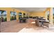 Spacious outdoor covered area featuring multiple tables and chairs perfect for dining or socializing at 17108 Harvest Moon Way, Bradenton, FL 34211