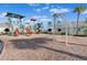 Community playground featuring slides, swings and a covered seating area for relaxation and fun at 17108 Harvest Moon Way, Bradenton, FL 34211