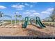Community playground features slides, swings, and climbing structures in a safe, mulched environment at 17108 Harvest Moon Way, Bradenton, FL 34211