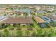 Enjoy this community aerial view featuring a lake, manicured lawns, and beautiful single Gathering homes at 17696 Northwood Pl, Lakewood Ranch, FL 34202