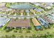 Stunning aerial view of homes surrounding a beautiful lake in a well-planned community at 17696 Northwood Pl, Lakewood Ranch, FL 34202