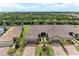 Aerial shot showcasing the paired villas with well-manicured lawns and paver driveways at 17696 Northwood Pl, Lakewood Ranch, FL 34202