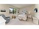 Cozy bedroom with window view, side table and light and nice decorations on the wall at 17696 Northwood Pl, Lakewood Ranch, FL 34202