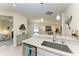 Open-concept kitchen featuring a breakfast bar with view to living room at 17696 Northwood Pl, Lakewood Ranch, FL 34202